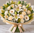 Creamy Classic hand-tied bouquet by Flowers Planet