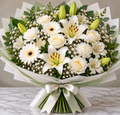 Serene Whites hand-tied bouquet by Flowers Planet