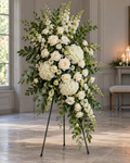 Everlasting Grace full standing funeral spray white roses, white hydrangeas and natural green foliage on black easel