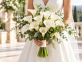 Pure Calla Bride: wedding bouquet of white calla lilies with slender green stems and natural foliage, bride holding arrangement